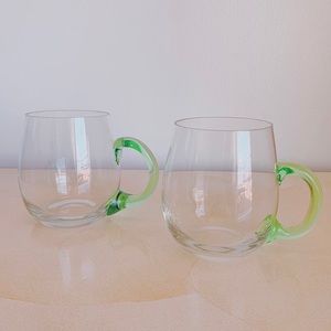 SOLD- Set of two glass mugs with green handles